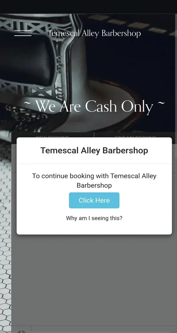 Temescal Alley Barber Shop's current homepage on a phone